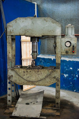 Old industrial machine for pressing in the workshop.