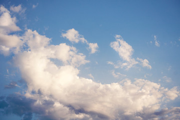 Naklejka na ściany i meble White light air clouds on a blue sky