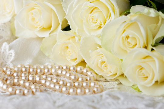 Romantic concept with roses  bouquet and pearl necklace