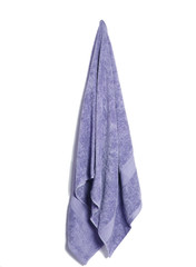 soft cotton bath towel hanging over beautiful background. Color and color cotton towel isolated.