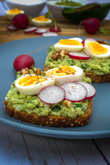 Sandwiches with avocado guacamole  fresh radish and boiled egg