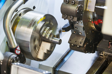 turning cnc machine at metal work industry. Precision manufacturing and machining