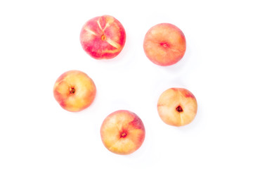 Vibrant organic flat saturn peaches, shot from the top on a white background, forming a circular frame with a place for text