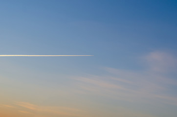 The plane flies and leaves a trail in the sky
