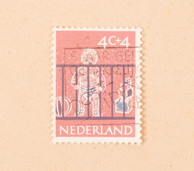THE NETHERLANDS 1960: A stamp printed in the Netherlands shows a baby, circa 1960