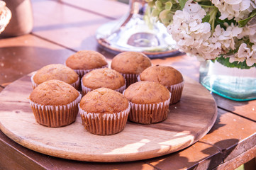 Banana cupcakes on the outdoor party table.