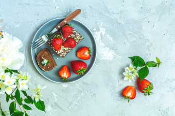 Naklejka na ściany i meble Chocolate roll cake with fresh strawberries
