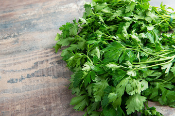 Organic parsley closeup on rustic wooden table