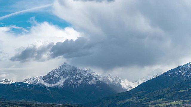 Timelapse of storm passing by mountain Serles in the Tyrolean Alps. clouds - rain - weather - blue sky