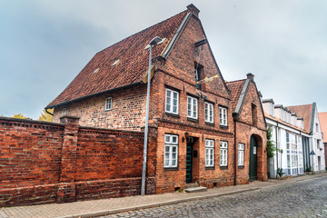 Street with Medieval old brick buildings. Luneburg. Germany