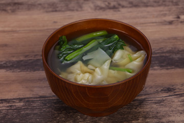 Asian traditional Wonton soup with herbs