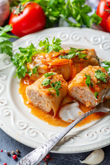 Cabbage rolls stuffed with ground beef and rice.