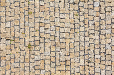 Old road paved with granite stones.