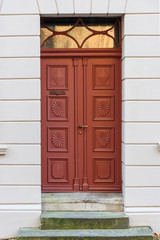 Fototapeta premium Old wooden front door in house. Luneburg. Germany