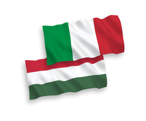 National vector fabric wave flags of Italy and Hungary isolated on white background. 1 to 2 proportion.