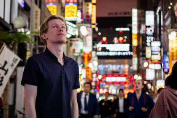 A handsome blond tourist looking of to the side