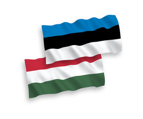 National vector fabric wave flags of Hungary and Estonia isolated on white background. 1 to 2 proportion.