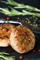 Fried pork tenderloin medallions with spices and herbs