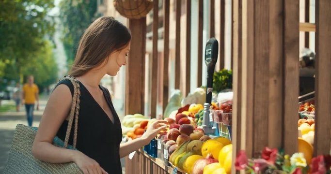 Woman choosing fruits