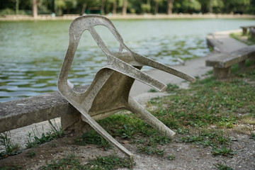 old plastic chair by the lake 