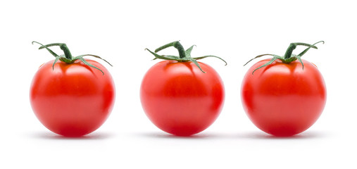 tomatoes with green leaves isolated on white background