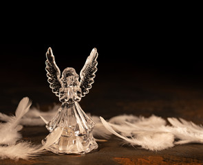 Glass angel on a dark background