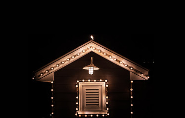 shiny classic bulb deocartion outdoor hut at night