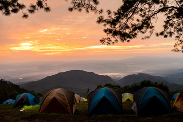Adventures Camping tourism and tent ,view forest landscape , outdoor in morning and sunset sky at Mon Sone View point , Doi Pha Hom Pok National Park in Chiang Mai, Thailand. Concept Travel.
