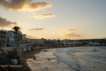 sunset over a sea side town