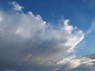Naklejka na ściany i meble Ant's eye view of dark clouds moving with blue sky background.