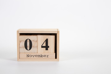 Wooden calendar November 04 on a white background