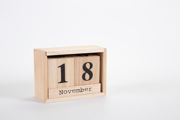 Wooden calendar November 18 on a white background