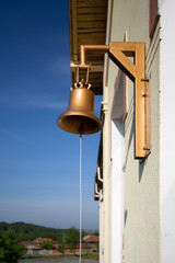 bell in front of building