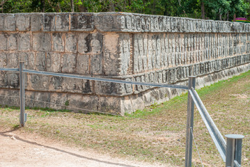 Mayan structure adorned with engraved skulls, in the archaeological area of Chichen Itza, on the Yucatan peninsula