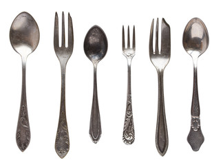 Vintage old spoons isolated on white background.