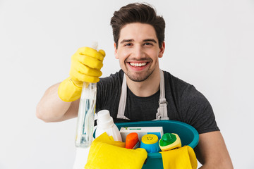 Handsome brunette houseman wearing apron