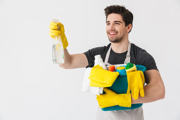 Handsome brunette houseman wearing apron