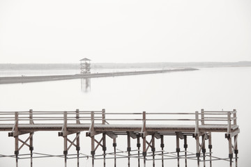 wooden pier over the lake and nobody around