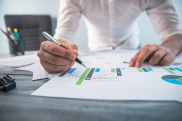 man hand pen with graph