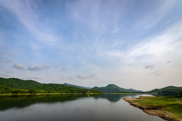 Obraz premium The landscape of nature with mountain, river, forest and clouds in the morning.