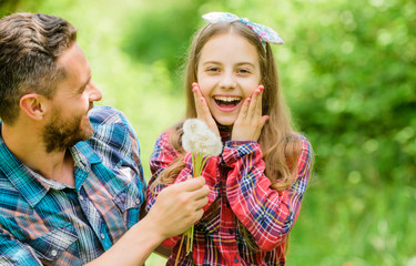 Thinking of ecology. little girl and happy man dad. earth day. spring village country. family summer farm. ecology. Happy family day. daughter and father love dandelion flower