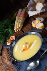 Super delicious asparagus soup with crab and capers .