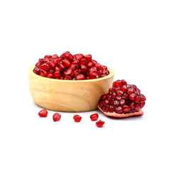 Pomegranate In a wooden cup isolated on the white background.