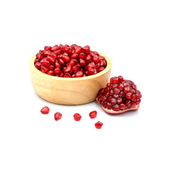 Pomegranate In a wooden cup isolated on the white background.