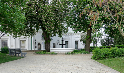 A courtyard with a fountain under blooming chestnuts in Kiev Pechersk Lavra