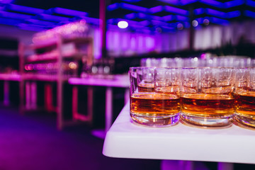 a lot of alcohol drinks on buffet table, catering