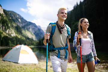 Group of happy young people friends hiking together outdoor