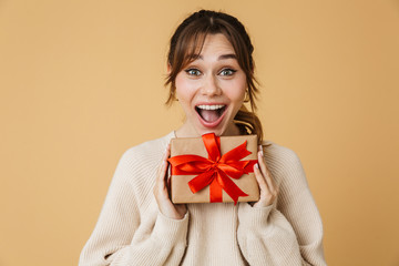 Fototapeta premium Beautiful young woman wearing sweater standing