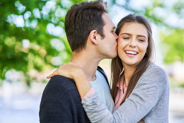 Fototapeta premium Young couple strolling in the park
