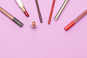 Items cosmetics for face on the lilac background